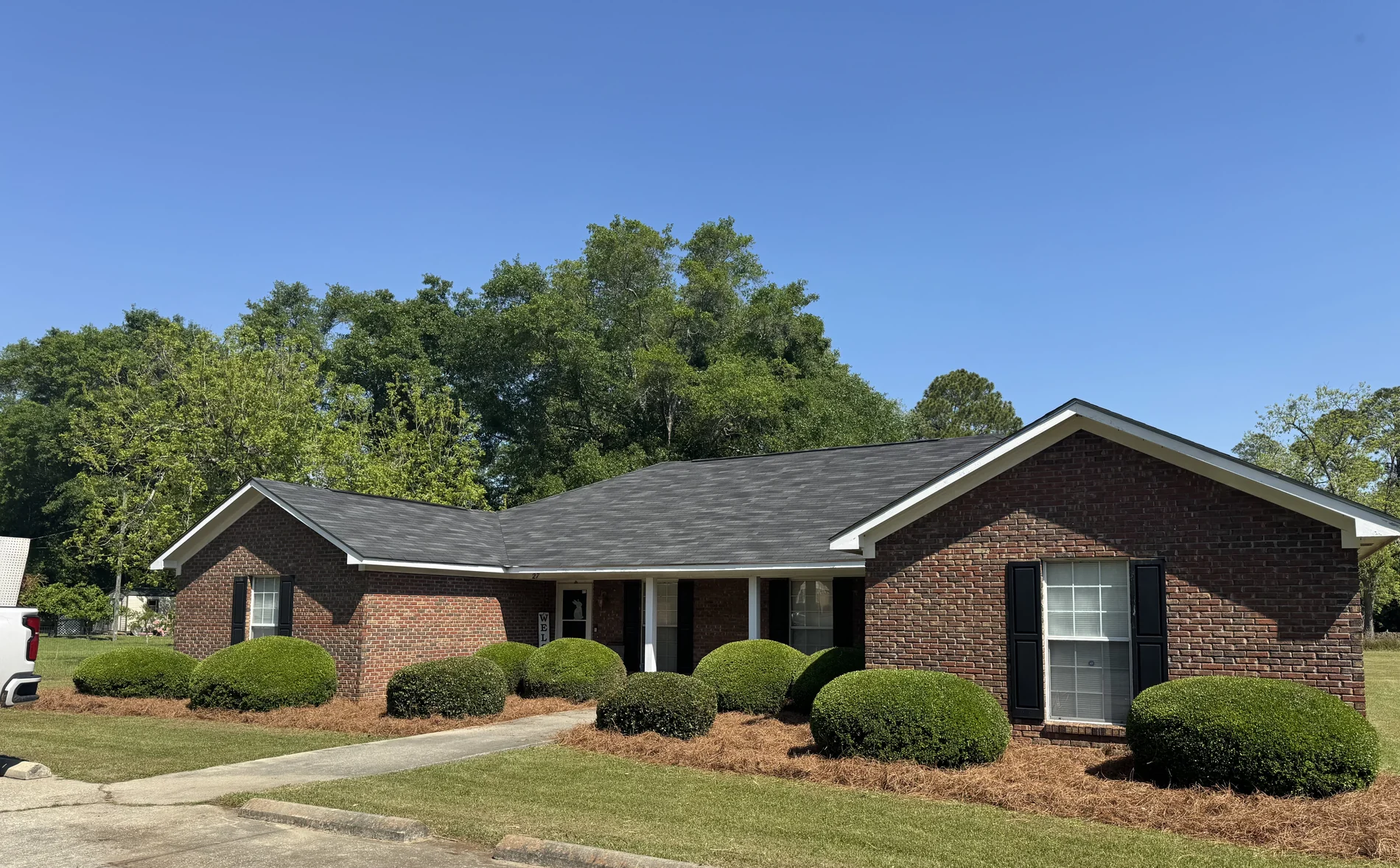 Front view of the one-story brick New Horizon residence